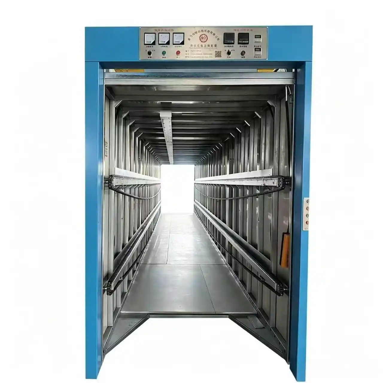 How does the electric translational curing chamber convey material rolls?